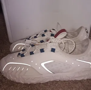 Adidas Cream Athletic Shoes Retro-Inspired Design