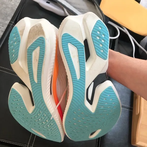 Hoka White and Red Athletic Shoes with Carbon Plate Design