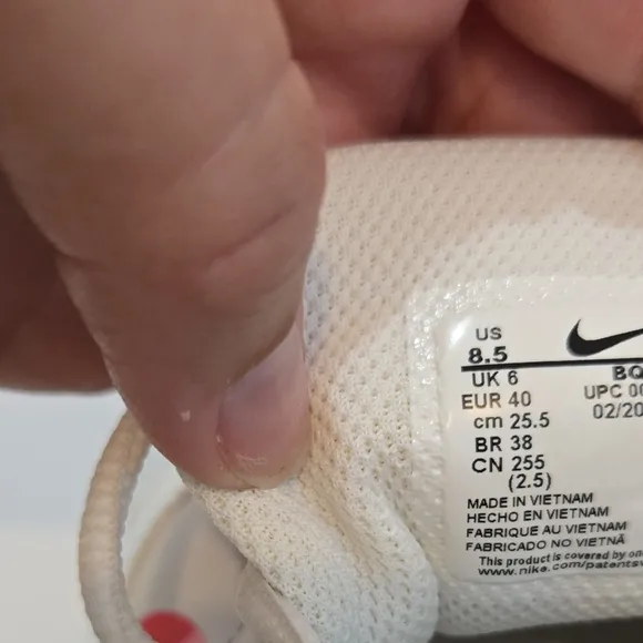 Nike White and Pink Athletic Shoes with Minimalist Design