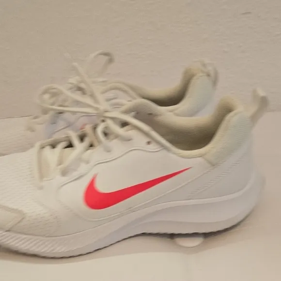 Nike White and Pink Athletic Shoes with Minimalist Design