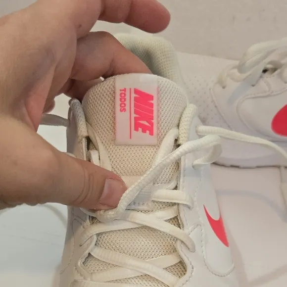 Nike White and Pink Athletic Shoes with Minimalist Design