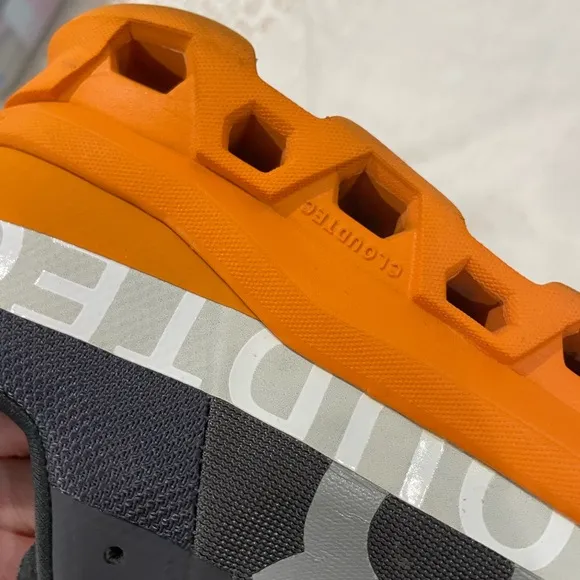 ON Men’s Cloudmonster Road Running Shoe 10.5 Eclipse Gray and Turmeric Orange