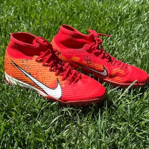 Red and Orange Nike Soccer Cleats